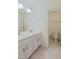 Bright bathroom with double vanity sinks and a bathtub/shower combo at 317 Springhurst Ln, Cary, NC 27511