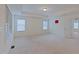 Bright bedroom with large windows, recessed lighting, and a neutral color palette at 317 Springhurst Ln, Cary, NC 27511