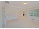 Airy bedroom with tray ceiling, recessed lighting, and a view of a fireplace at 317 Springhurst Ln, Cary, NC 27511