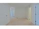 Spacious bedroom featuring neutral carpet, white walls, and ample natural light at 317 Springhurst Ln, Cary, NC 27511
