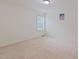 Bright, carpeted bedroom with a window offers a serene retreat at 317 Springhurst Ln, Cary, NC 27511