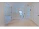 Bright hallway features carpet flooring, white walls, and access to multiple rooms at 317 Springhurst Ln, Cary, NC 27511