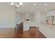 Open floor plan showcases hardwood floors connecting the living and dining areas, with a fireplace at 317 Springhurst Ln, Cary, NC 27511