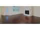 Bright living room with hardwood floors, fireplace and large windows for lots of natural light at 317 Springhurst Ln, Cary, NC 27511