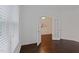 Well-lit office featuring hardwood floors, French doors, and minimalist decor at 317 Springhurst Ln, Cary, NC 27511