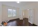 Bright office space with hardwood floors and a view of the entryway through French doors at 317 Springhurst Ln, Cary, NC 27511