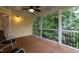 Inviting screened-in porch with a ceiling fan offers relaxing outdoor living at 317 Springhurst Ln, Cary, NC 27511