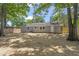 View of home's backyard featuring a well-maintained lawn and privacy fence at 3204 Winfield Ct, Raleigh, NC 27610