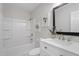 This bathroom features a tub/shower and a white vanity with a gray countertop at 3204 Winfield Ct, Raleigh, NC 27610