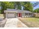 Charming single-story home features a vibrant red door and a well-manicured front yard at 3204 Winfield Ct, Raleigh, NC 27610