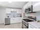 Modern kitchen features stainless steel appliances, subway tile backsplash, and quartz countertops at 3204 Winfield Ct, Raleigh, NC 27610