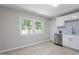 Kitchen area with lots of natural light, stainless steel dishwasher, quartz countertops, and neutral paint at 3204 Winfield Ct, Raleigh, NC 27610