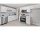 Modern kitchen features stainless steel appliances, subway tile backsplash, and quartz countertops at 3204 Winfield Ct, Raleigh, NC 27610