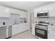 Modern kitchen features stainless steel appliances, subway tile backsplash, and quartz countertops at 3204 Winfield Ct, Raleigh, NC 27610