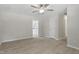 Bright living room features modern ceiling fan, fresh paint, and neutral luxury vinyl plank floors at 3204 Winfield Ct, Raleigh, NC 27610
