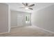 Bright living room features modern ceiling fan, fresh paint, and neutral luxury vinyl plank floors at 3204 Winfield Ct, Raleigh, NC 27610