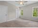 Bedroom with a ceiling fan and windows to provide great light at 344 Colonial Ridge Dr, Pittsboro, NC 27312