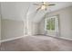 A cozy bedroom with a ceiling fan and windows bringing in natural light at 344 Colonial Ridge Dr, Pittsboro, NC 27312