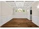 Dining area with hardwood floors, coffered ceiling, chandelier, and wainscoting detail at 344 Colonial Ridge Dr, Pittsboro, NC 27312
