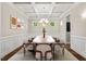 Formal dining room with coffered ceiling, chandelier, and wainscoting, perfect for entertaining at 344 Colonial Ridge Dr, Pittsboro, NC 27312