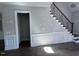 Foyer showcasing hardwood floors, wainscoting, and a staircase with wrought iron railings at 344 Colonial Ridge Dr, Pittsboro, NC 27312