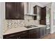 Close-up of kitchen details featuring stainless steel appliances and stone countertops at 344 Colonial Ridge Dr, Pittsboro, NC 27312