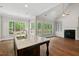 Open kitchen design with hardwood floors and a large island with counter seating at 344 Colonial Ridge Dr, Pittsboro, NC 27312