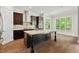 Spacious kitchen with an island, stainless steel appliances, and tile backsplash at 344 Colonial Ridge Dr, Pittsboro, NC 27312