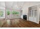 Bright living room boasting a fireplace, built-in shelving, and a scenic view from the large windows at 344 Colonial Ridge Dr, Pittsboro, NC 27312