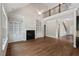 Beautiful living room with hardwood floors, a fireplace, built-in cabinets and easy access to the staircase at 344 Colonial Ridge Dr, Pittsboro, NC 27312