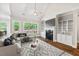 Comfortable living room features a fireplace, large windows, and stylish decor for relaxation at 344 Colonial Ridge Dr, Pittsboro, NC 27312