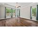 Bright and airy main bedroom with hardwood floors and large windows at 344 Colonial Ridge Dr, Pittsboro, NC 27312