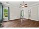 Main bedroom showcasing hardwood floors, tray ceiling and natural light at 344 Colonial Ridge Dr, Pittsboro, NC 27312
