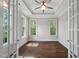 Sunlit office with tray ceiling, hardwood floors, and glass French doors with natural light at 344 Colonial Ridge Dr, Pittsboro, NC 27312
