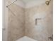 Shower featuring decorative tile and a recessed niche for storage at 344 Colonial Ridge Dr, Pittsboro, NC 27312