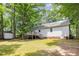 Spacious backyard features a well-maintained lawn and a shed, perfect for outdoor activities and storage at 352 Riverstone Dr, Clayton, NC 27527