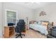 Cozy bedroom setup with a desk, gaming chair, and a comfortable daybed at 352 Riverstone Dr, Clayton, NC 27527