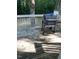 Deck area featuring a BBQ grill ready for outdoor entertaining in wooded backyard at 352 Riverstone Dr, Clayton, NC 27527