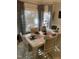 Formal dining room boasts natural light, elegant decor, and a seating arrangement for six at 352 Riverstone Dr, Clayton, NC 27527