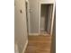 Hallway with wood floors and multiple doorways leading to other rooms at 352 Riverstone Dr, Clayton, NC 27527