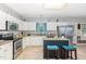 Functional kitchen featuring stainless steel appliances, granite counters, and a breakfast bar, creating an efficient workspace at 352 Riverstone Dr, Clayton, NC 27527