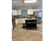 Bright kitchen features granite countertops, stainless steel appliances, an island, and white cabinetry at 352 Riverstone Dr, Clayton, NC 27527