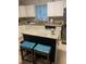 Bright kitchen features granite countertops, stainless steel appliances, an island, and white cabinetry at 352 Riverstone Dr, Clayton, NC 27527