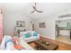 Bright living room featuring hardwood floors, neutral paint, and an open layout seamlessly connecting to the kitchen at 352 Riverstone Dr, Clayton, NC 27527