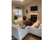 Cozy living room featuring a fireplace, TV, and comfortable seating at 352 Riverstone Dr, Clayton, NC 27527