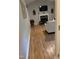 Hardwood flooring leads to the cozy living room and fireplace at 352 Riverstone Dr, Clayton, NC 27527