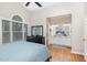 Bright main bedroom with vaulted ceiling, large window, and ensuite bathroom with double sinks at 352 Riverstone Dr, Clayton, NC 27527