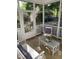 Relaxing screened porch with comfortable seating and views of the landscaped yard at 352 Riverstone Dr, Clayton, NC 27527