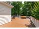 Large wooden deck perfect for outdoor entertaining, surrounded by lush trees and privacy at 3821 La Costa Way, Raleigh, NC 27610