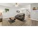 Comfortable living room featuring modern decor, a plush sofa, and easy access to the updated kitchen at 3821 La Costa Way, Raleigh, NC 27610